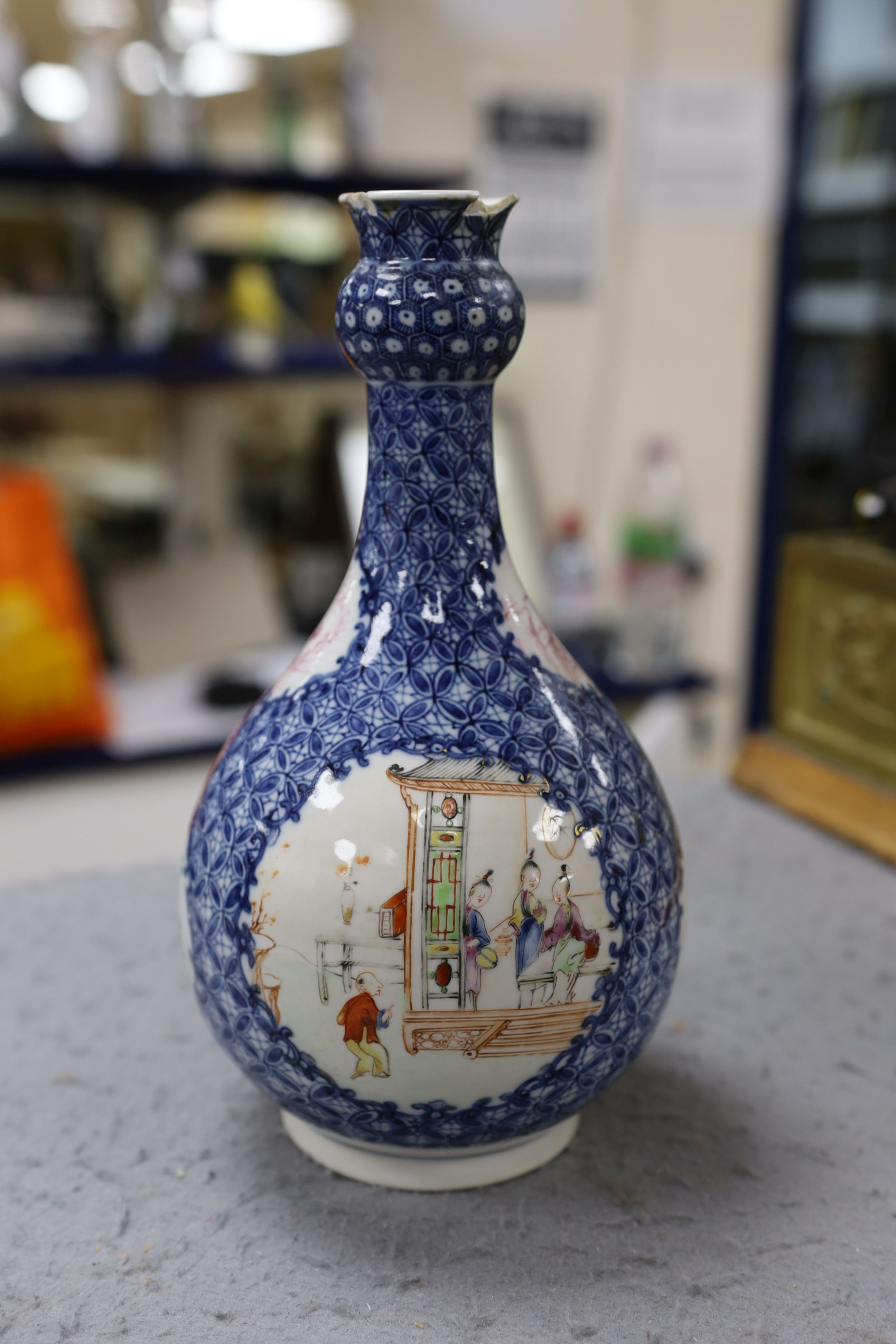 A pair Samson of Paris vases in the Chinese famille verte style and a Chinese Qianlong famille rose garlic neck vase with blue panelling motif, tallest 26cm